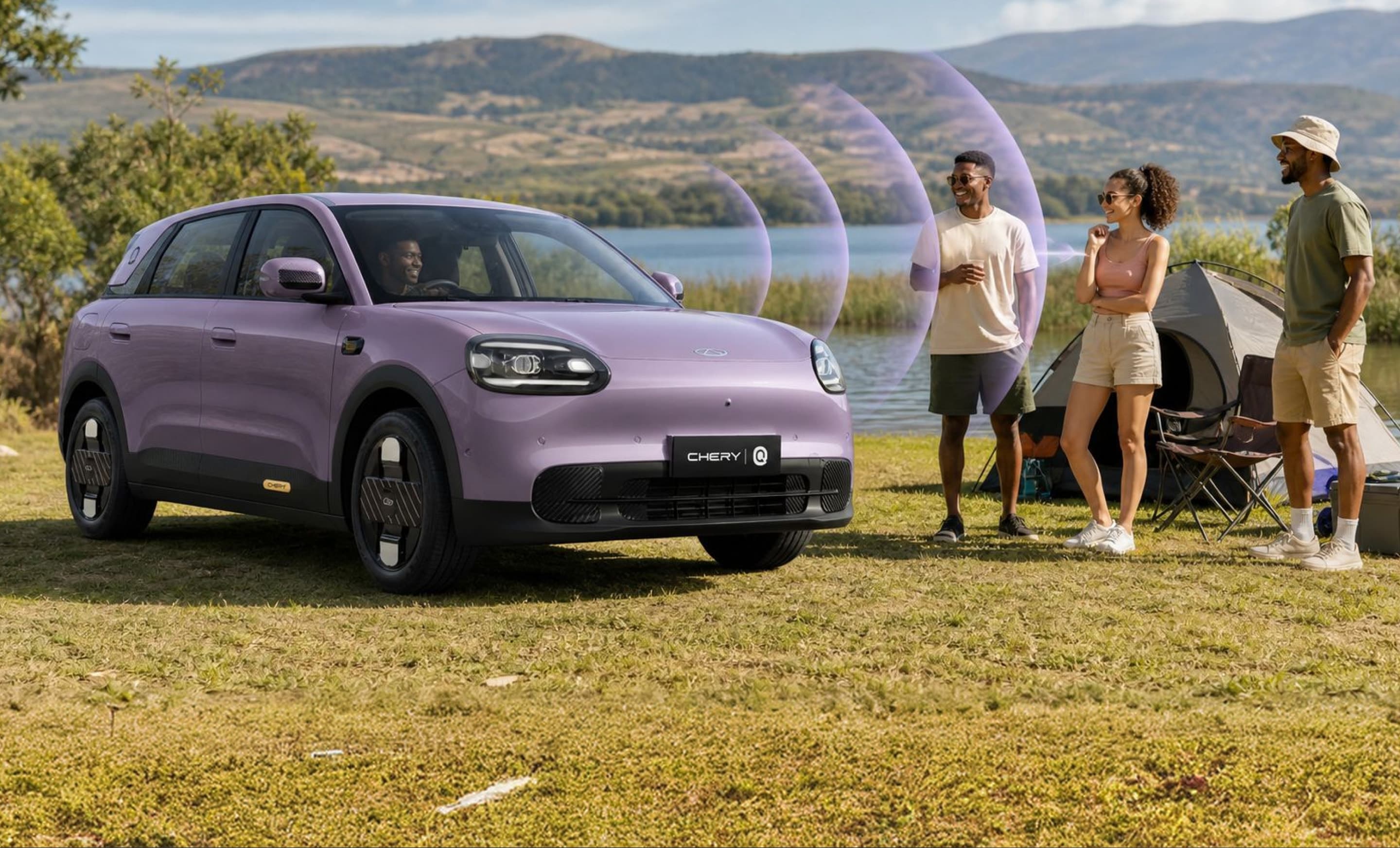 Chery Q projecting sound toward campers beside a lake